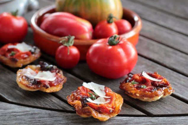 Caramelised balsamic onion cherry tomato tarte tatin canape with fresh thyme parmesan